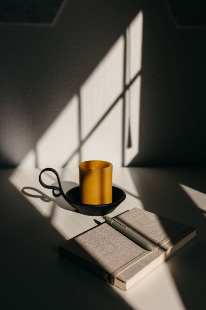 candle and notebook